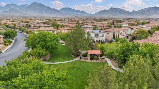 aerial view of residential area featuring a mountain backdrop