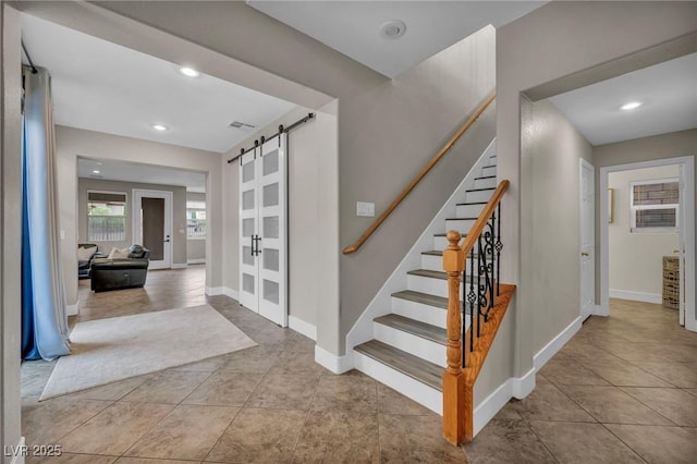 617 Apricot Rose Pl, Las Vegas, NV 89138 - stairway featuring a barn door, tile patterned floors, baseboards, and recessed lighting