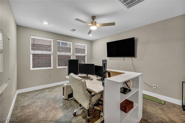 office area with ceiling fan and baseboards