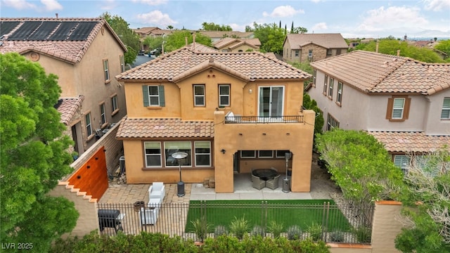 617 Apricot Rose Pl, Las Vegas, NV 89138 - rear view of property featuring a fenced backyard, stucco siding, a balcony, a tiled roof, and a residential view
