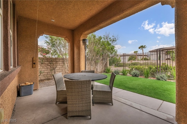 617 Apricot Rose Pl, Las Vegas, NV 89138 - fenced backyard with outdoor dining area and a patio