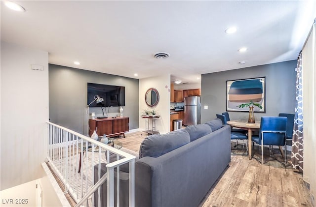 1553 Dorothy Ave Unit 4, Las Vegas, NV 89119 - living room featuring light wood finished floors, recessed lighting, and baseboards