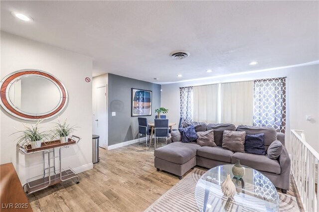 1553 Dorothy Ave Unit 4, Las Vegas, NV 89119 - living room featuring light wood-style floors, recessed lighting, and baseboards