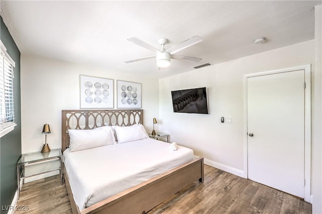 1553 Dorothy Ave Unit 4, Las Vegas, NV 89119 - bedroom featuring wood finished floors, baseboards, and a ceiling fan
