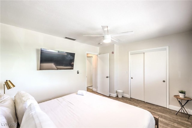 1553 Dorothy Ave Unit 4, Las Vegas, NV 89119 - bedroom featuring wood finished floors, baseboards, a closet, and a ceiling fan