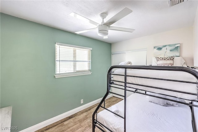 1553 Dorothy Ave Unit 4, Las Vegas, NV 89119 - bedroom with wood finished floors, baseboards, and ceiling fan