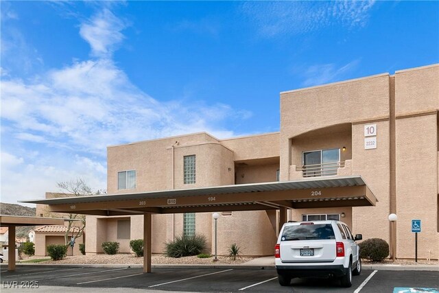 2232 Aspen Mirror Way Unit 202, Laughlin, NV 89029 - view of property featuring covered parking