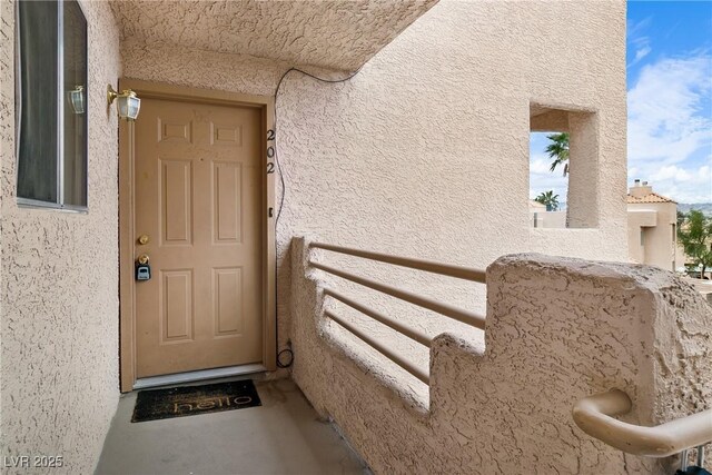 2232 Aspen Mirror Way Unit 202, Laughlin, NV 89029 - entrance to property with a balcony and stucco siding