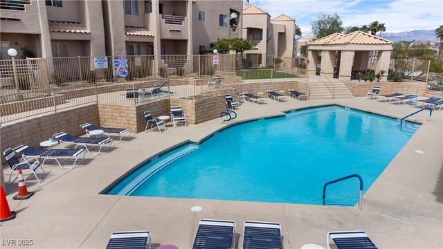 2232 Aspen Mirror Way Unit 202, Laughlin, NV 89029 - community pool with a patio and fence