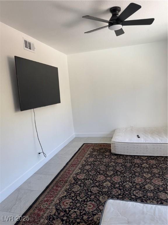 bedroom with baseboards and ceiling fan