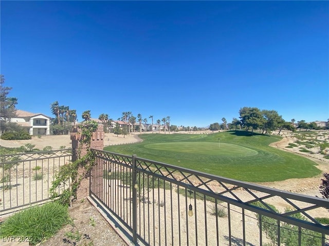 balcony featuring an area to practice putting and view of golf course