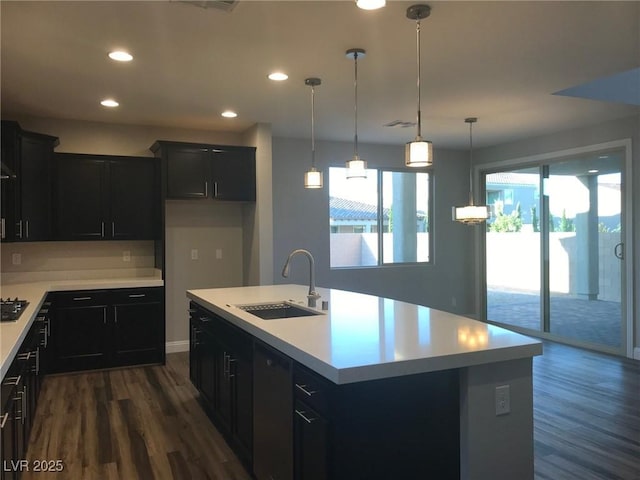 1027 Cambridge Park St, Las Vegas, NV 89148 - kitchen with a sink, dark wood-style flooring, light countertops, dark cabinetry, and recessed lighting