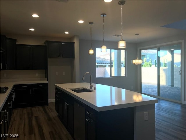 1027 Cambridge Park St, Las Vegas, NV 89148 - kitchen featuring a sink, dark wood finished floors, light countertops, dark cabinetry, and recessed lighting
