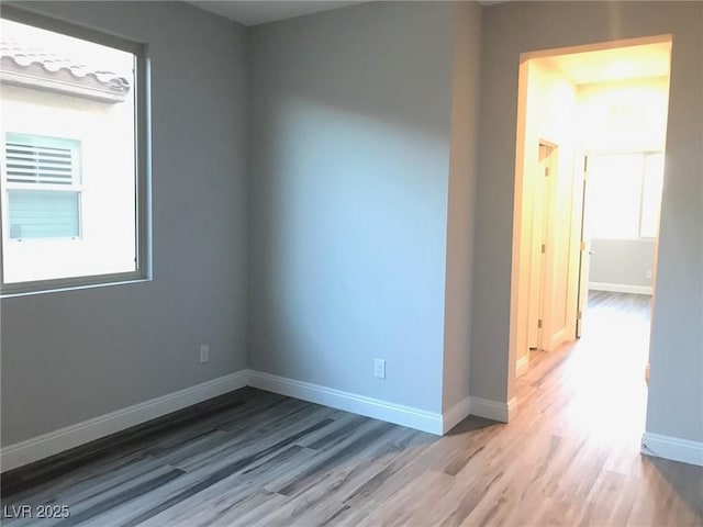 1027 Cambridge Park St, Las Vegas, NV 89148 - unfurnished room featuring wood finished floors and baseboards