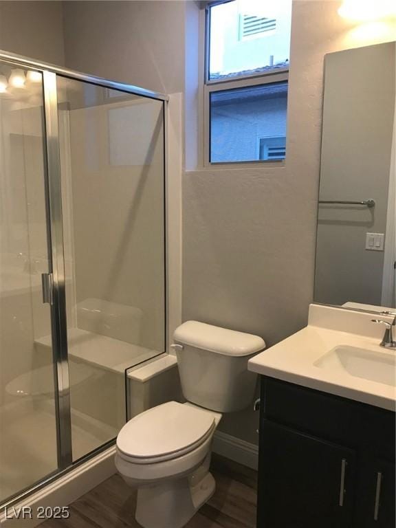 1027 Cambridge Park St, Las Vegas, NV 89148 - bathroom with toilet, a shower stall, vanity, and wood finished floors