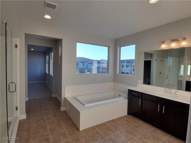 1027 Cambridge Park St, Las Vegas, NV 89148 - full bathroom featuring a stall shower, tile patterned floors, vanity, a bath, and recessed lighting