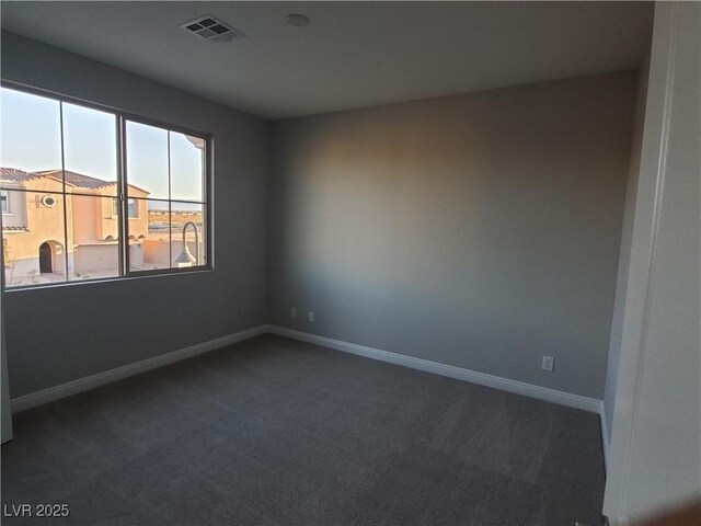 1027 Cambridge Park St, Las Vegas, NV 89148 - empty room featuring dark carpet and baseboards