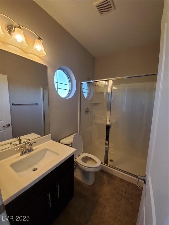 1027 Cambridge Park St, Las Vegas, NV 89148 - full bath featuring a shower stall, tile patterned floors, vanity, and toilet