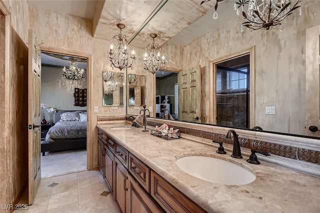 7501 Midnight Rambler St, Las Vegas, NV 89149 - ensuite bathroom with a chandelier, double vanity, and tile patterned flooring