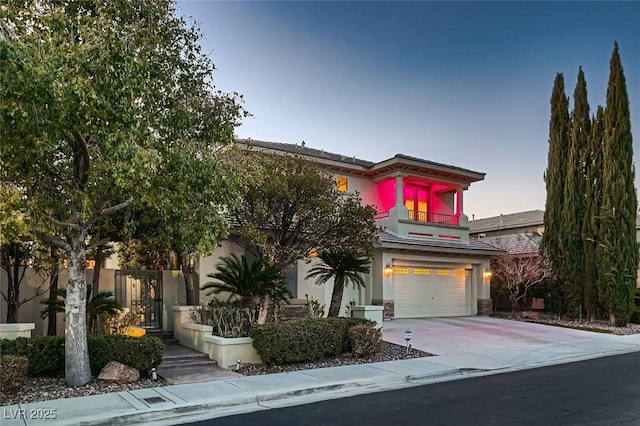 7501 Midnight Rambler St, Las Vegas, NV 89149 - view of front of property with a garage, concrete driveway, stucco siding, and stone siding