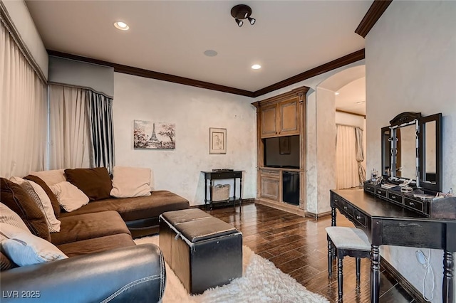 7501 Midnight Rambler St, Las Vegas, NV 89149 - living room with arched walkways, crown molding, dark wood finished floors, recessed lighting, and baseboards