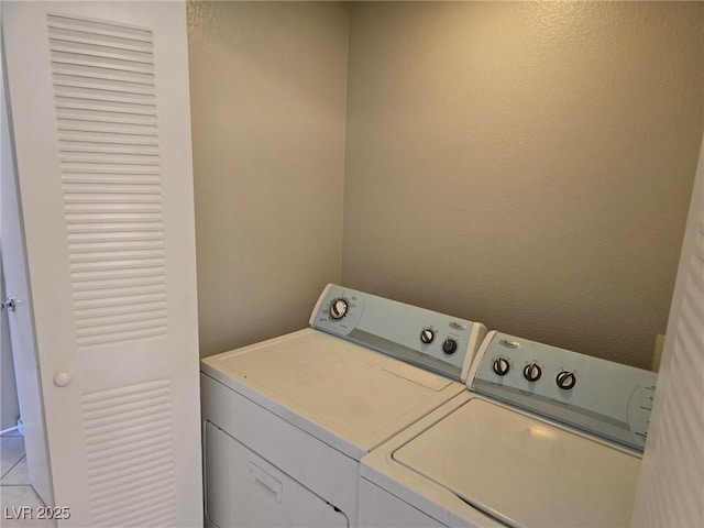 washroom with washing machine and dryer