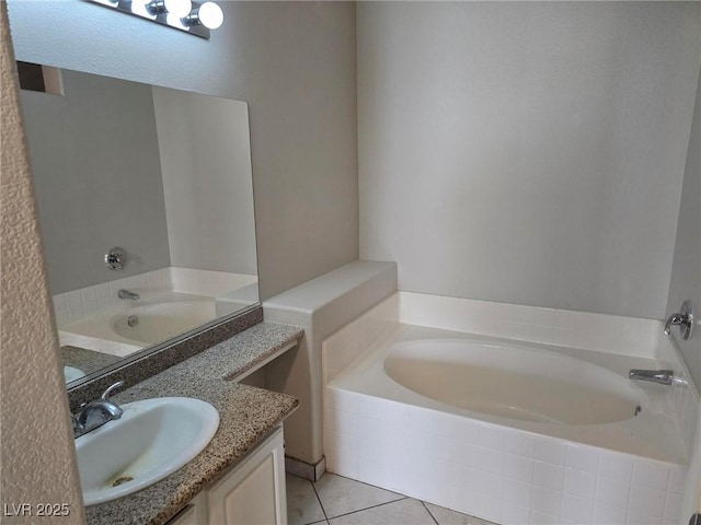 bathroom featuring a bath, tile patterned flooring, and vanity