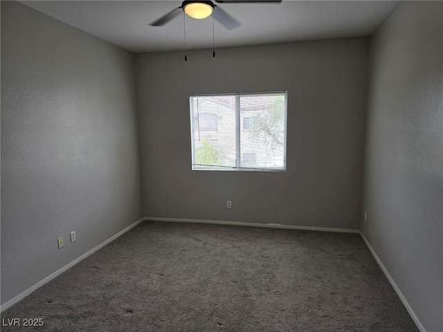 unfurnished room with a ceiling fan, carpet flooring, and baseboards