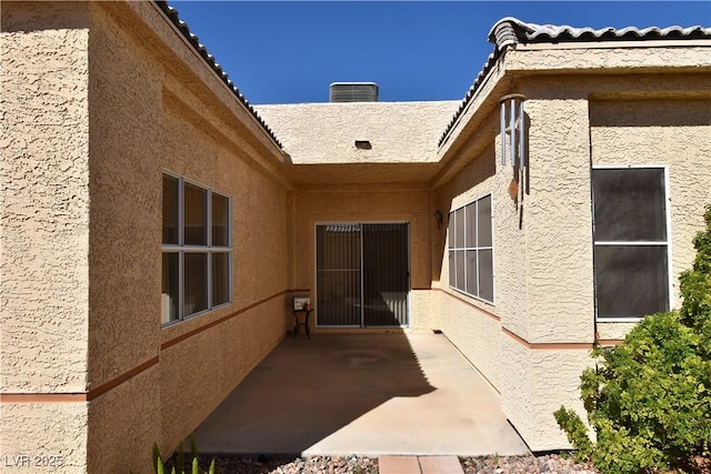 back of property featuring stucco siding and a patio area