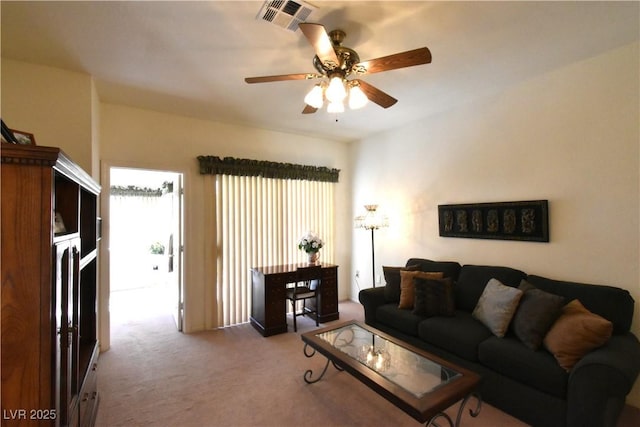carpeted living room with a ceiling fan