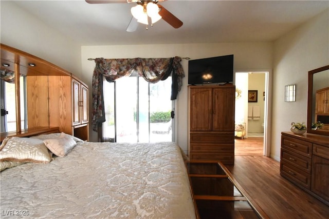 bedroom with access to outside, wood finished floors, a ceiling fan, and arched walkways
