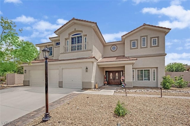 7211 Heggie Ave, Las Vegas, NV 89131 - mediterranean / spanish-style home featuring stucco siding, a tile roof, a garage, concrete driveway, and fence