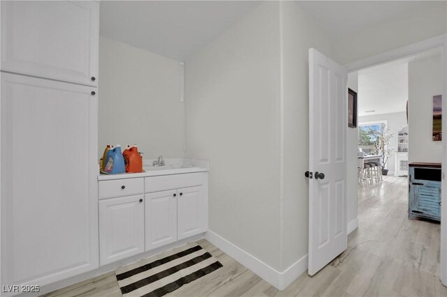 7211 Heggie Ave, Las Vegas, NV 89131 - bathroom featuring wood finished floors and baseboards