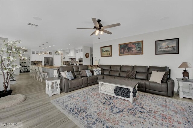 7211 Heggie Ave, Las Vegas, NV 89131 - living room with a ceiling fan, light wood-type flooring, and recessed lighting