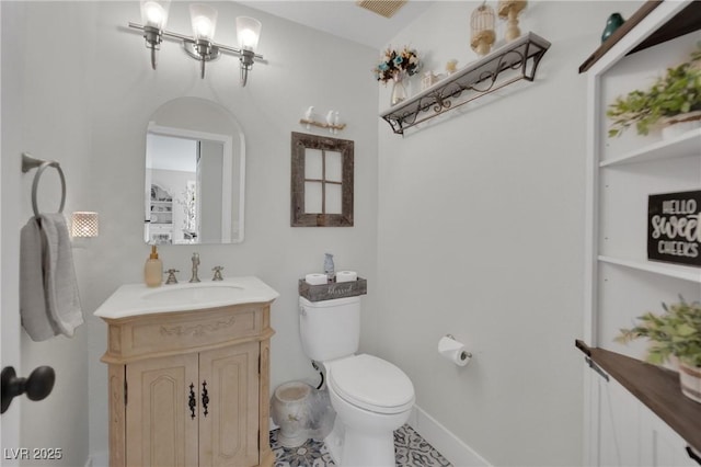 7211 Heggie Ave, Las Vegas, NV 89131 - bathroom with toilet, vanity, and baseboards