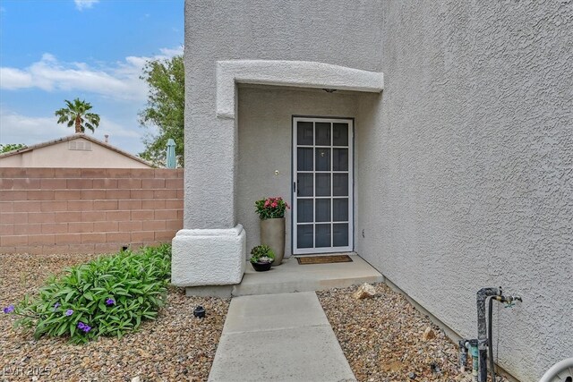 4820 Integrity St, North Las Vegas, NV 89031 - entrance to property featuring stucco siding and fence