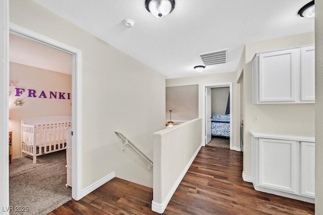 4820 Integrity St, North Las Vegas, NV 89031 - hallway with an upstairs landing, dark wood finished floors, and baseboards