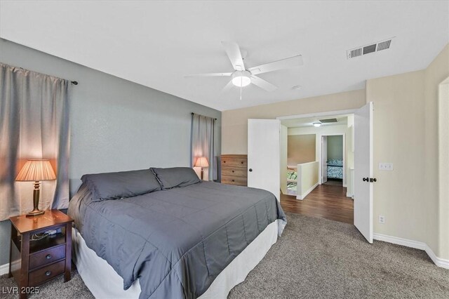 4820 Integrity St, North Las Vegas, NV 89031 - carpeted bedroom with baseboards and a ceiling fan