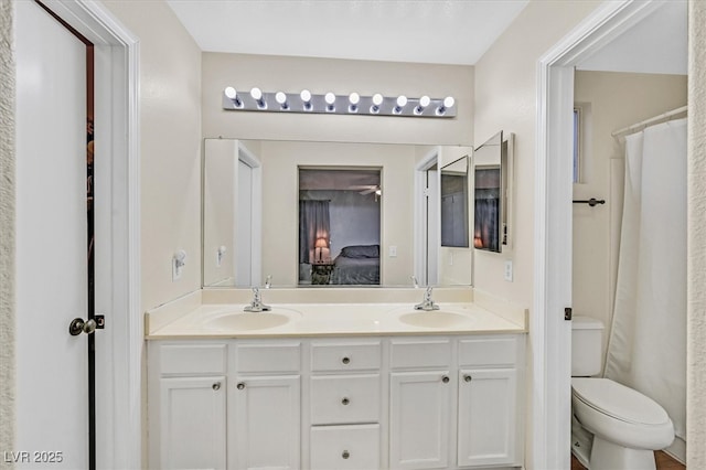 4820 Integrity St, North Las Vegas, NV 89031 - ensuite bathroom featuring toilet and double vanity