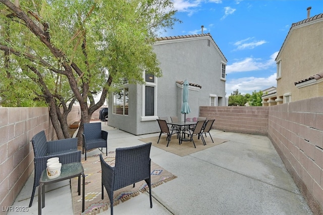 4820 Integrity St, North Las Vegas, NV 89031 - view of patio featuring a fenced backyard and outdoor dining area