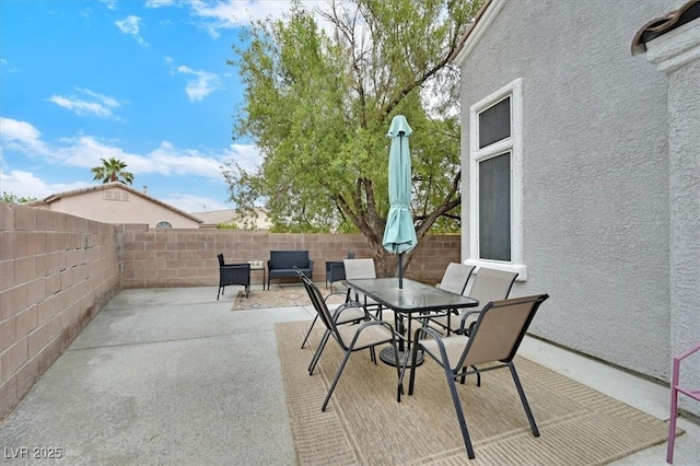 4820 Integrity St, North Las Vegas, NV 89031 - view of patio featuring a fenced backyard and outdoor dining area