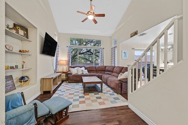 4820 Integrity St, North Las Vegas, NV 89031 - living area with a ceiling fan, dark wood finished floors, high vaulted ceiling, baseboards, and built in shelves
