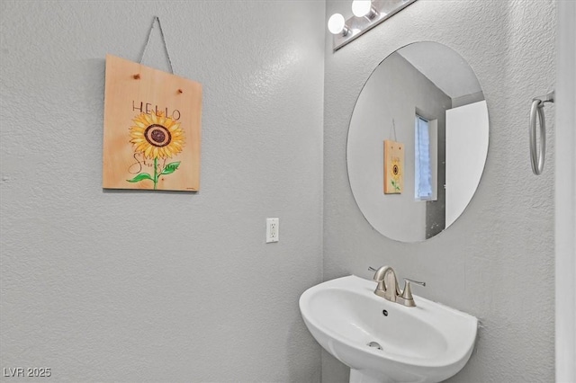 4820 Integrity St, North Las Vegas, NV 89031 - bathroom with a sink and a textured wall