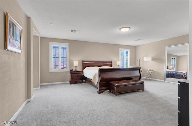bedroom featuring carpet floors and baseboards