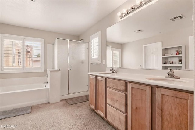 full bath featuring a stall shower, a garden tub, double vanity, and carpet flooring
