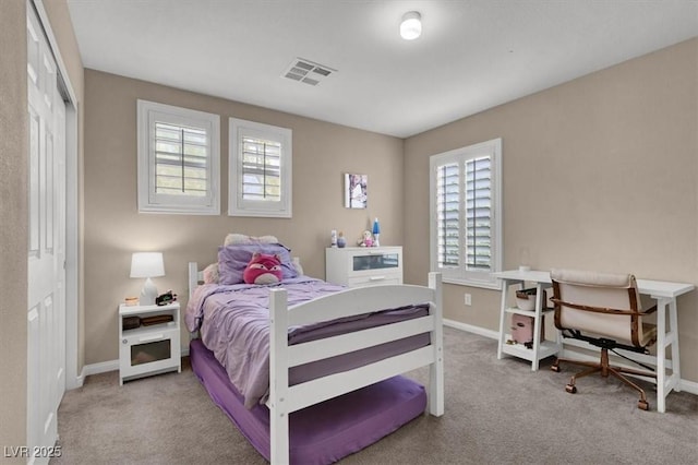 bedroom featuring carpet floors, baseboards, and a closet