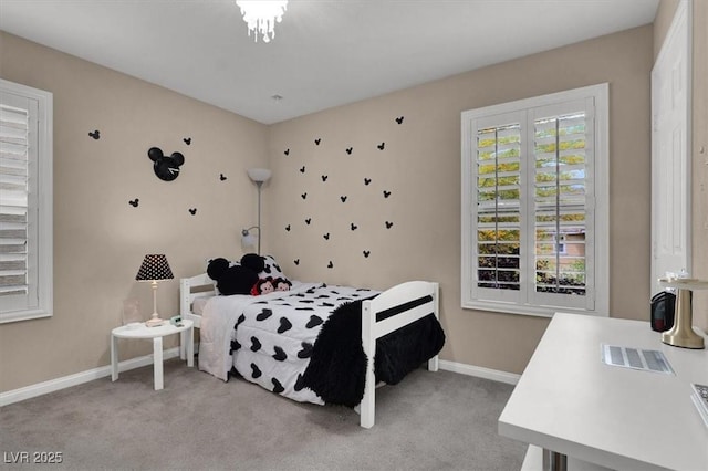 bedroom featuring carpet floors and baseboards