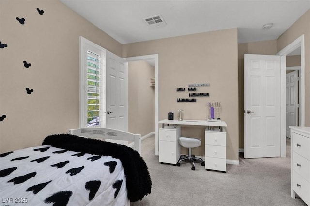bedroom featuring light carpet and baseboards