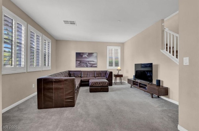 living room featuring carpet floors and baseboards