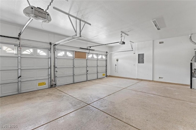 garage featuring a garage door opener, electric panel, and baseboards